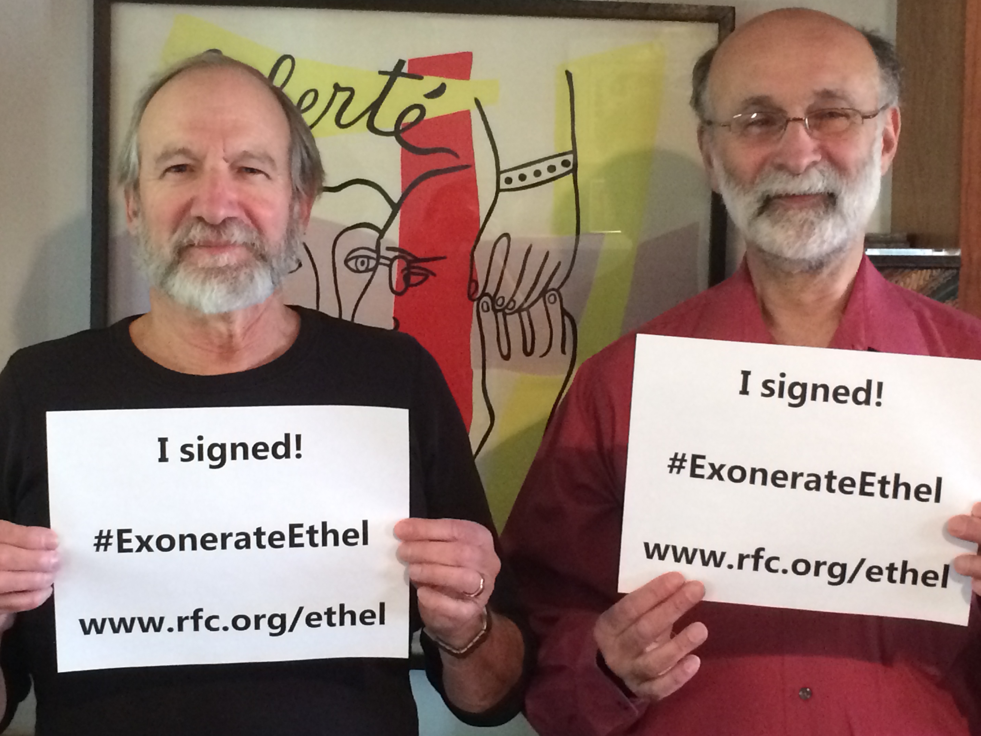 Robert and Michael Meeropol hold I Signed posters in support of the Exonerate Ethel campaign